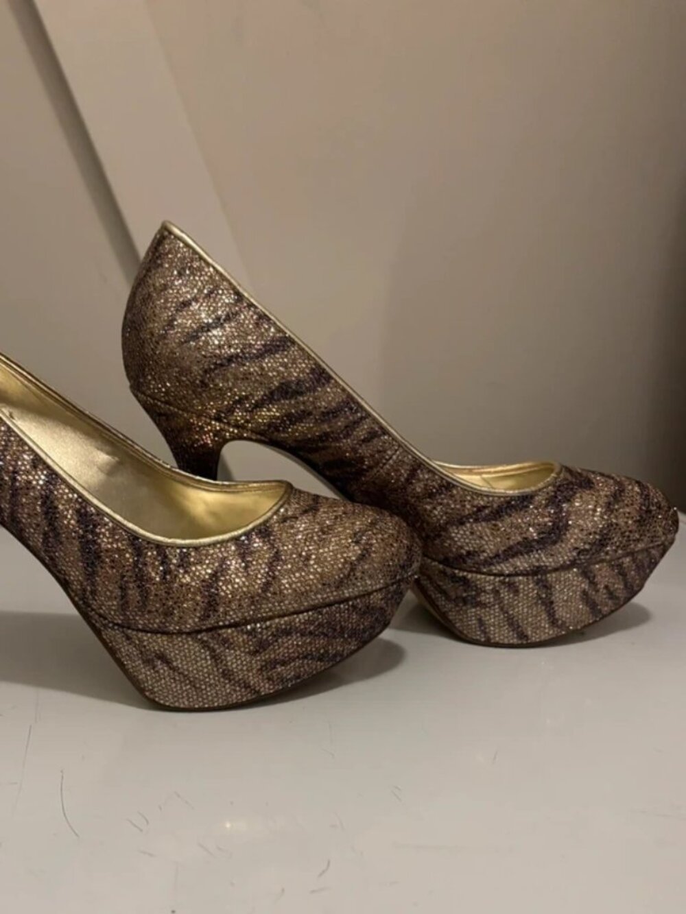 Black and gold pumps